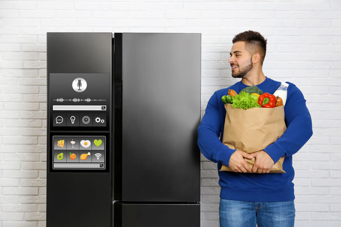 Man looking to the Smart Fridge