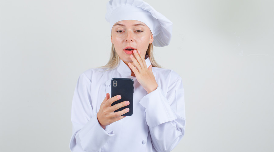 chef holding smartphone